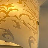 Polished and screen-printed glass sconce by eglo