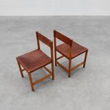 Pair of wood and leather Spanish chairs by Jordi Vilanova, ca. 1960