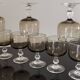 9 white wine glasses on vintage Luminarc smoked black stem