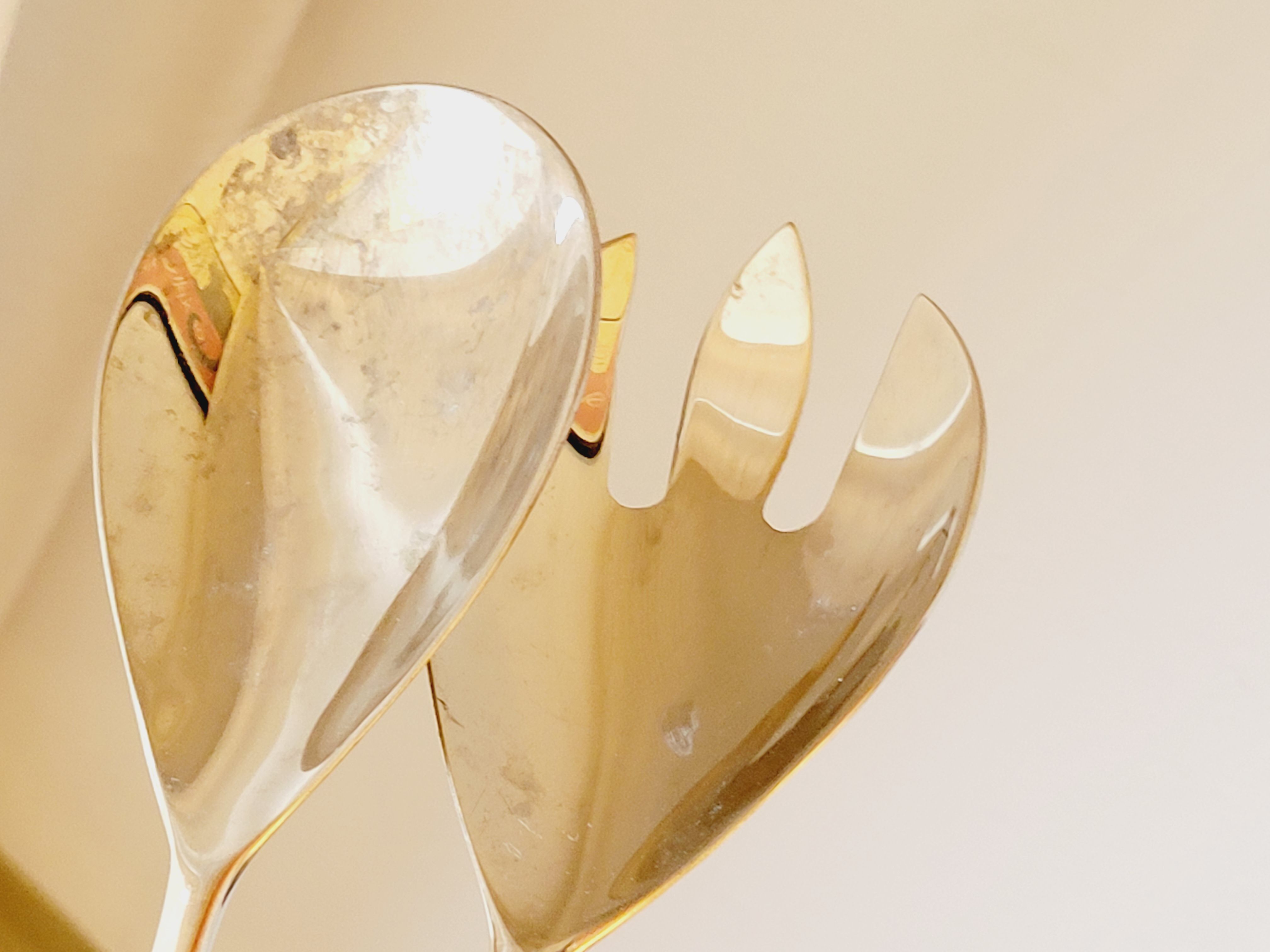 Set of salad serving cutlery in silver metal and resin