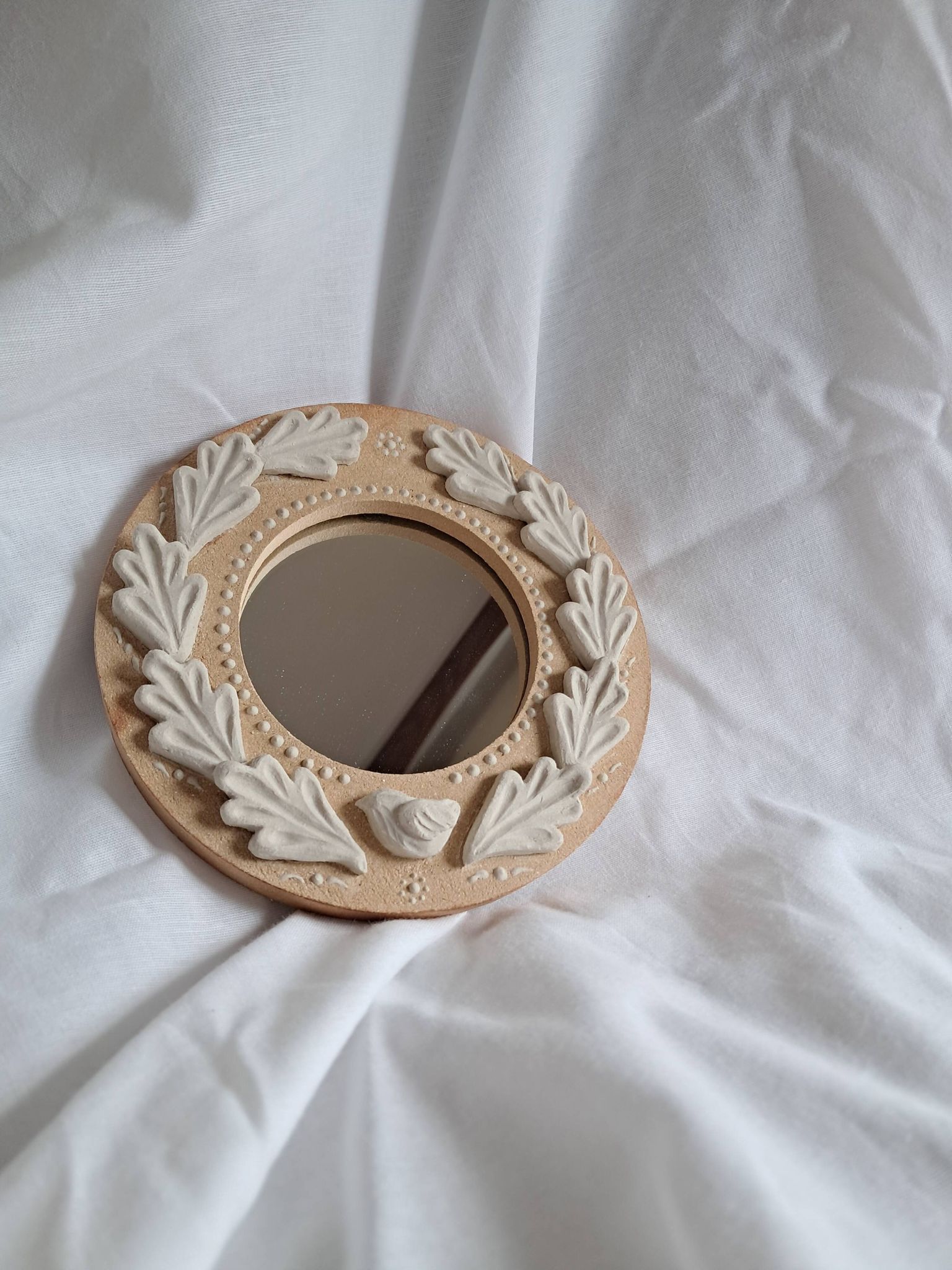 Red and white stoneware mirror, oak leaves