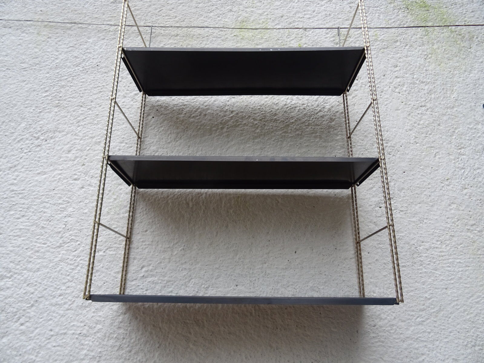 Metal thong wall shelf