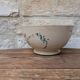 Old opaque porcelain bowl from Gien with a floral decoration.