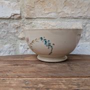 Old opaque porcelain bowl from Gien with a floral decoration.