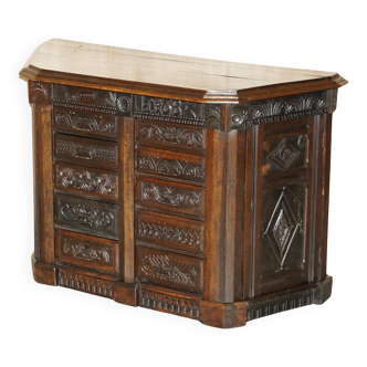 Hand-carved commode from 1685 with sideboards and side cupboards.