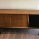 Sideboard with double sliding doors and bar on a metal base