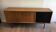 Sideboard with double sliding doors and bar on a metal base