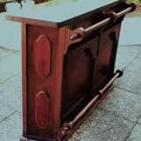 Bar counter in solid exotic teak wood; molded panel decor.