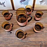 Orangeade set with pitcher and 6 amber glass glasses with "woven" fabric surround