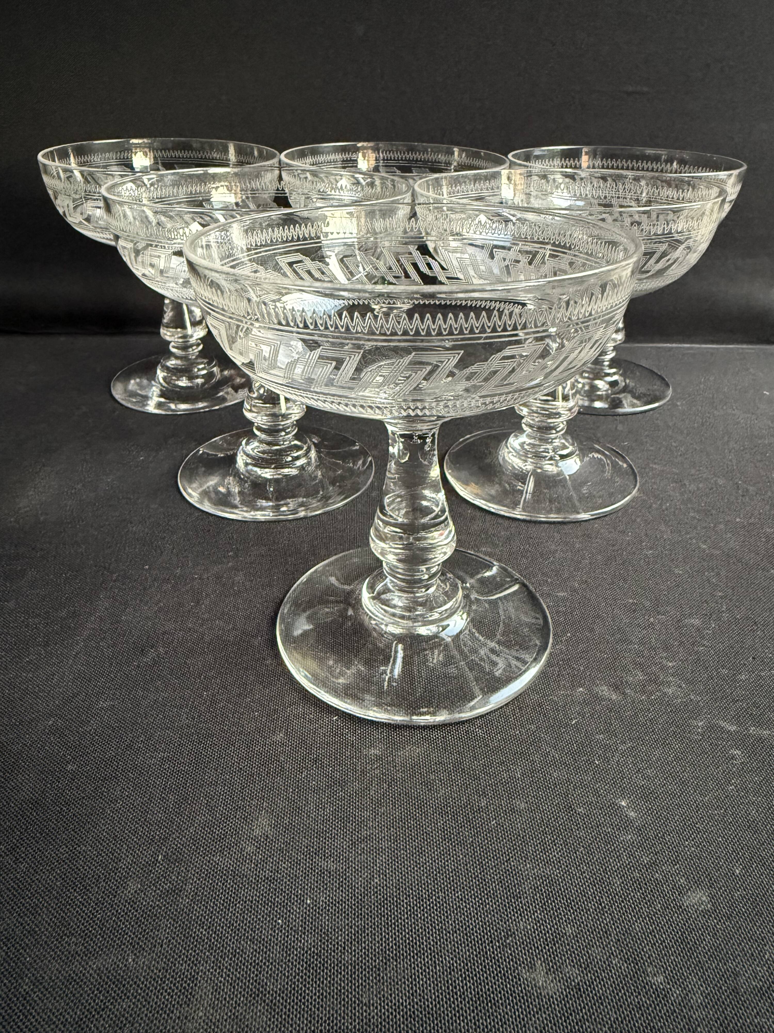6 Baccarat champagne coupes with Greek engraving, slanted.