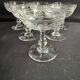 6 Baccarat champagne coupes with Greek engraving, slanted.