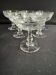 6 Baccarat champagne coupes with Greek engraving, slanted.
