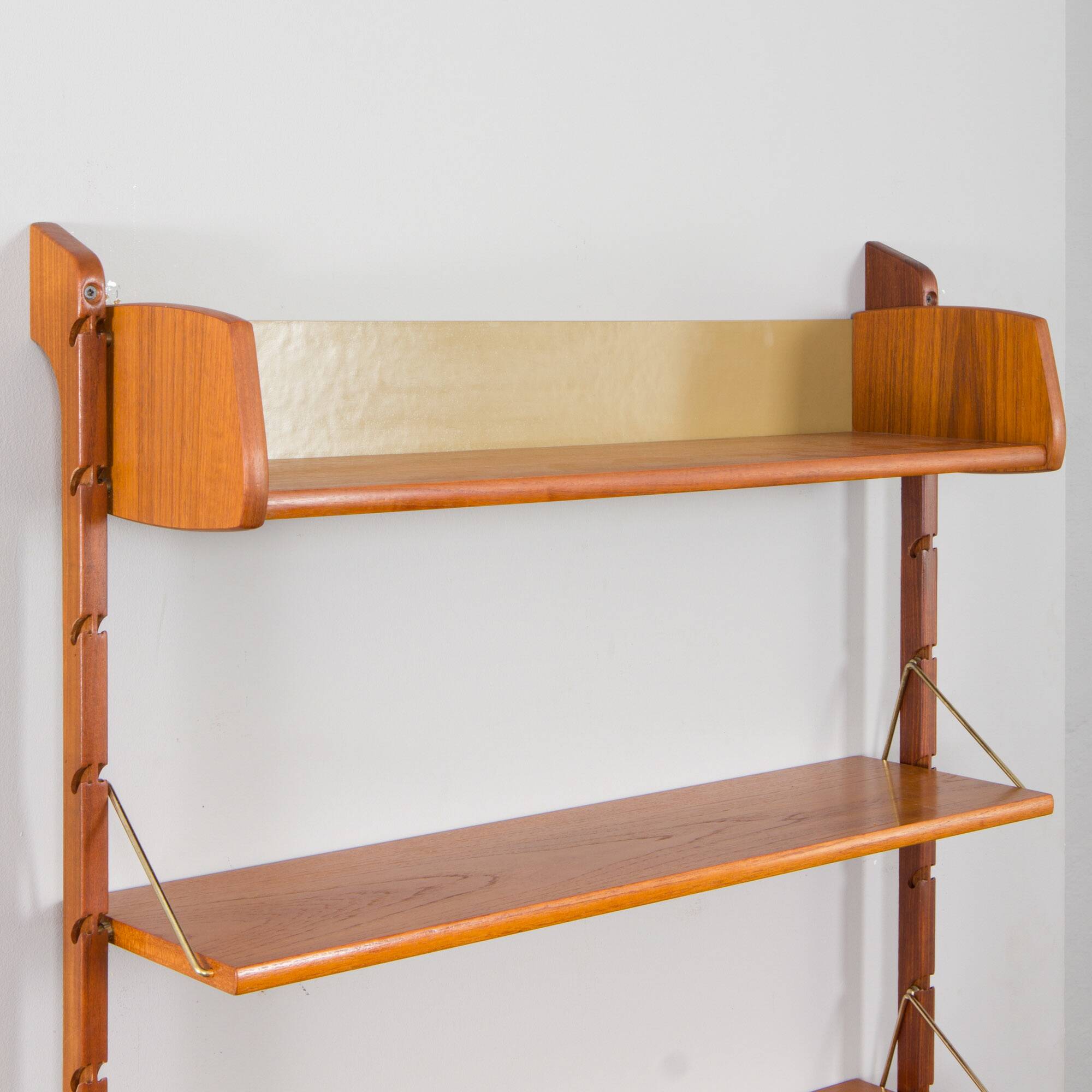 Scandinavian modern wall shelving system Ergo in teak by J. Texmon, Norway, 1960s