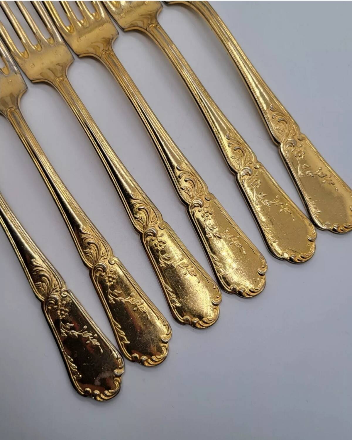 12 Table Forks in gold metal