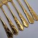 12 Table Forks in gold metal