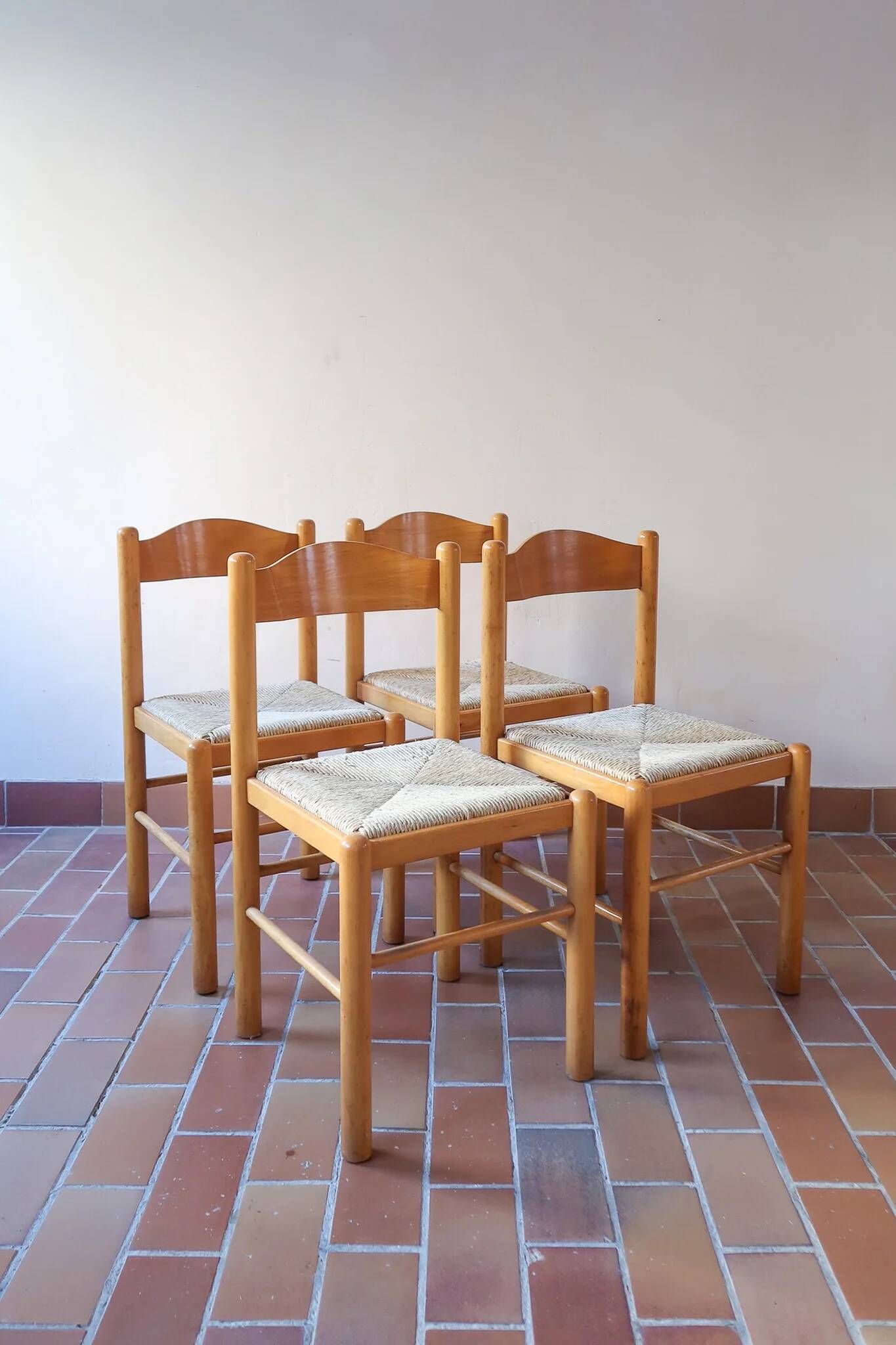 4 solid pine chairs, straw seats, shaped backrest.