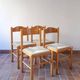 4 solid pine chairs, straw seats, shaped backrest.