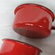 Red enamelled sheet metal pans