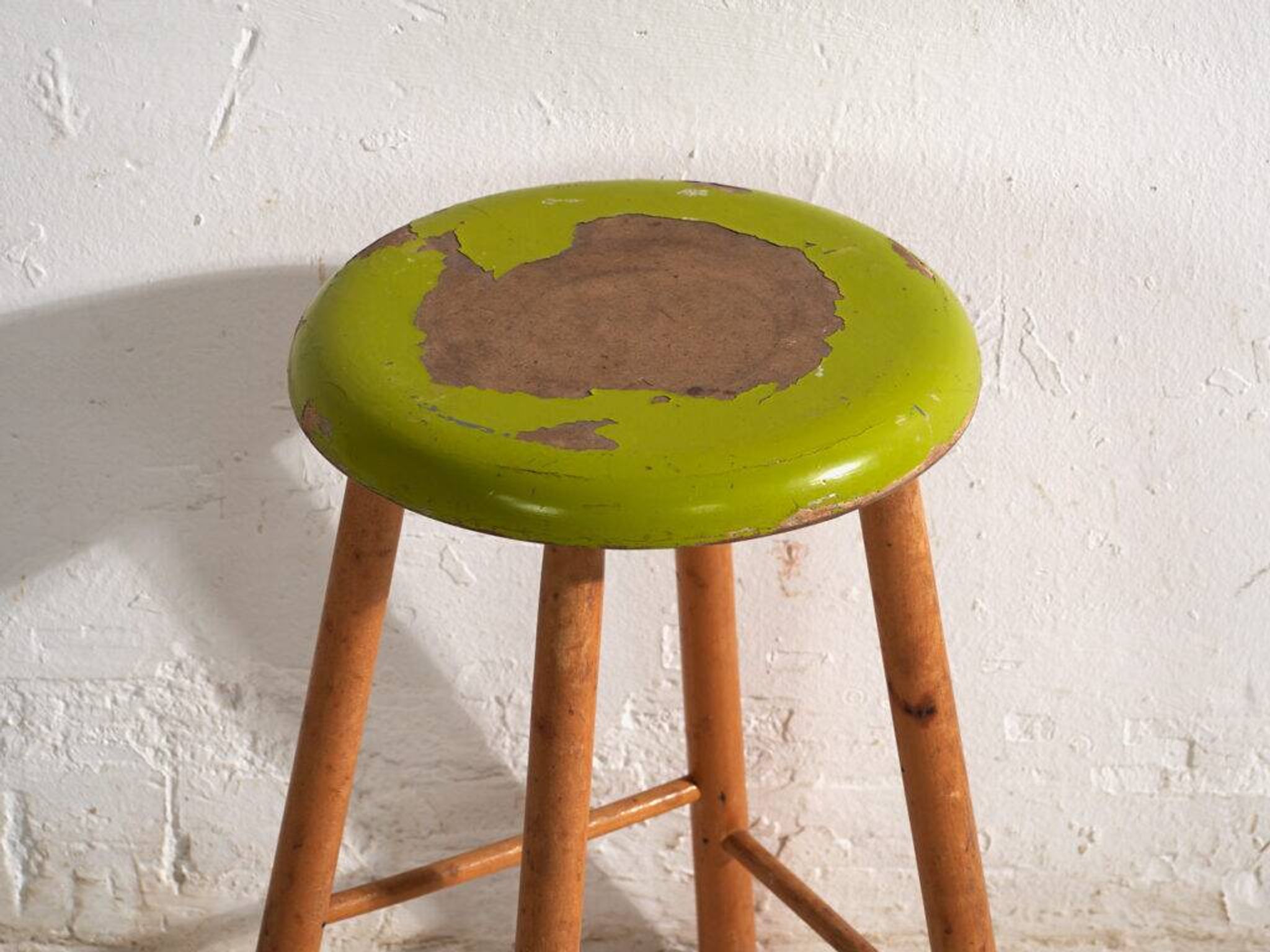 Antique wooden stool with a round seat – Central Europe, circa 1950