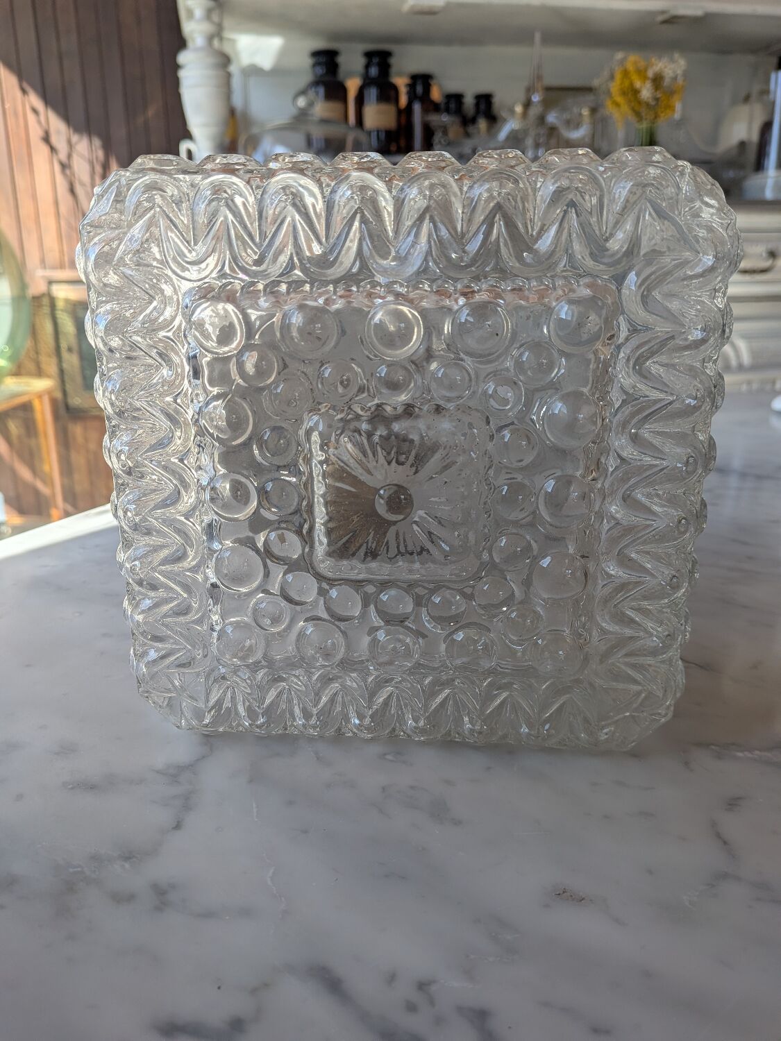 Pressed glass wall light