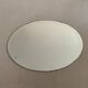 Old bevelled stitched oval mirror
