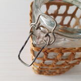 Pair of glass jars and rush