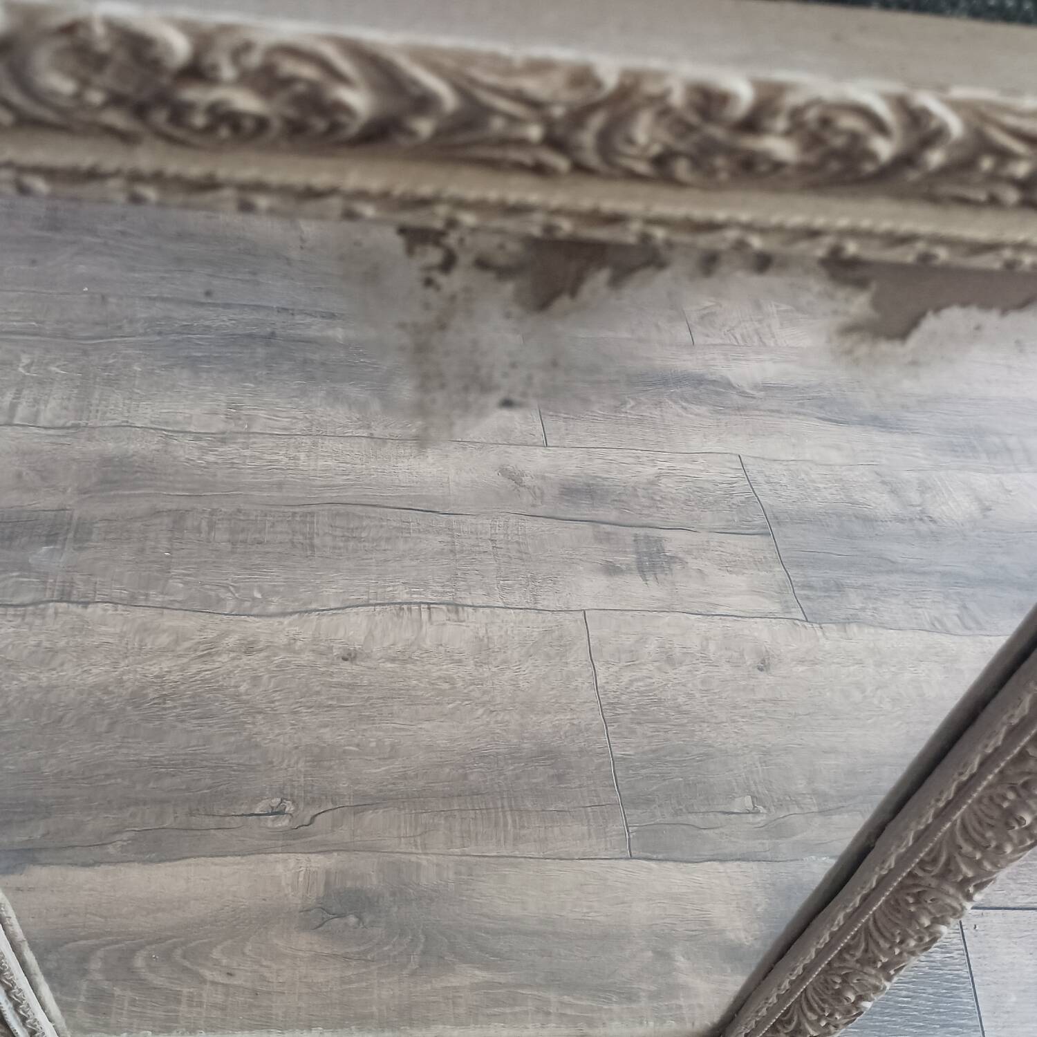 Antique mirror in carved, painted and patinated wood