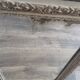 Antique mirror in carved, painted and patinated wood