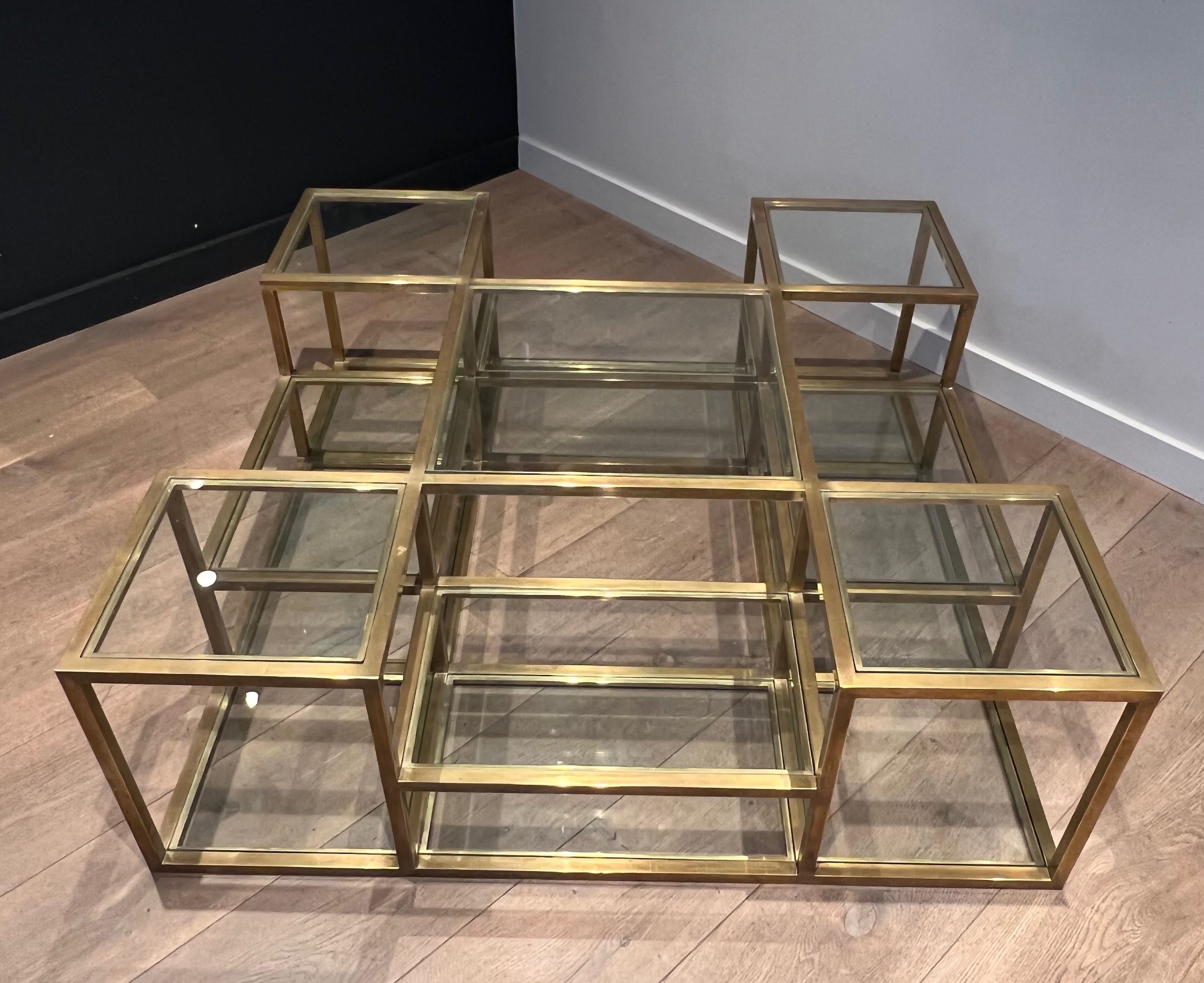 Important brass coffee table with multiple levels.