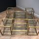 Important brass coffee table with multiple levels.