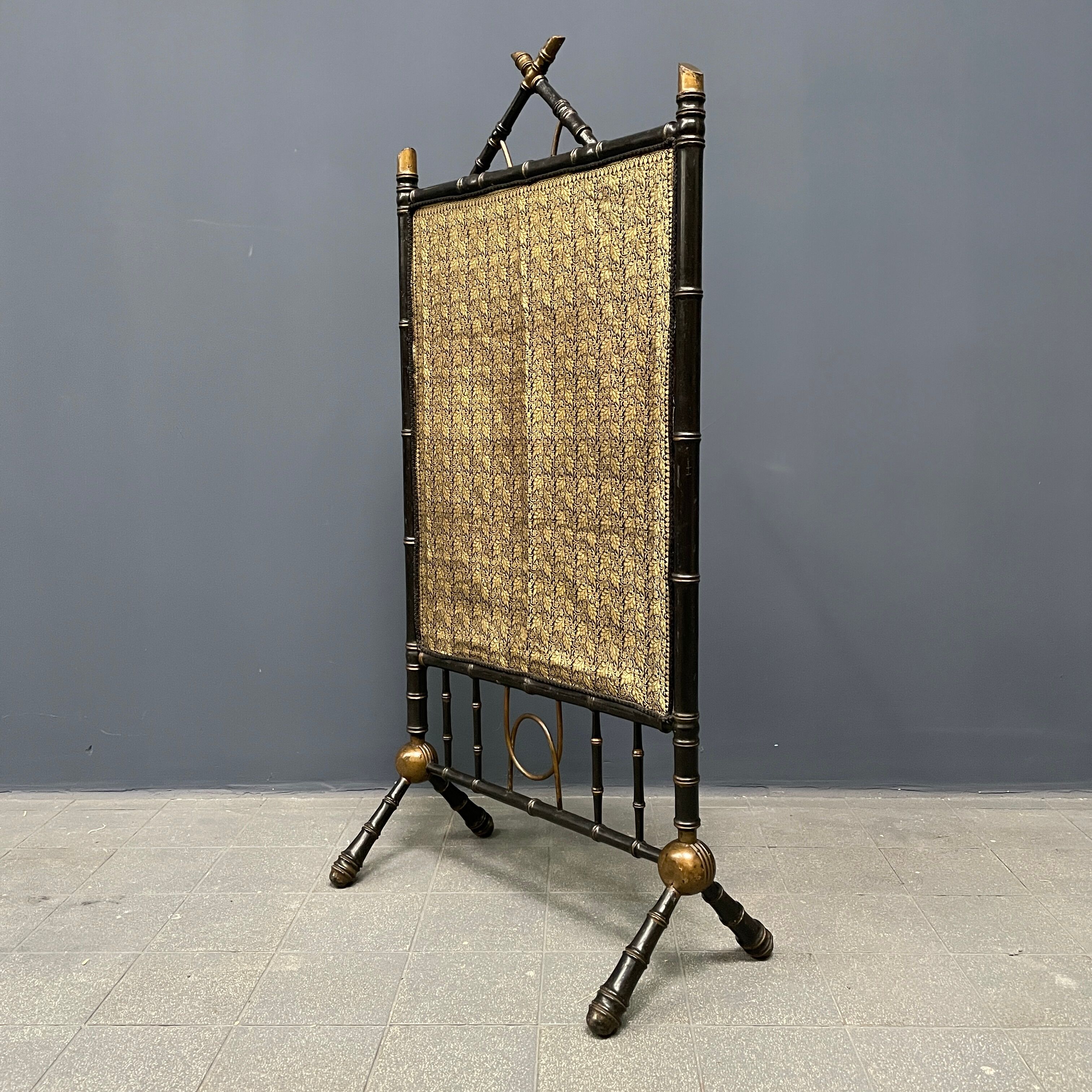 Antique black and gold faux bamboo fireplace screen