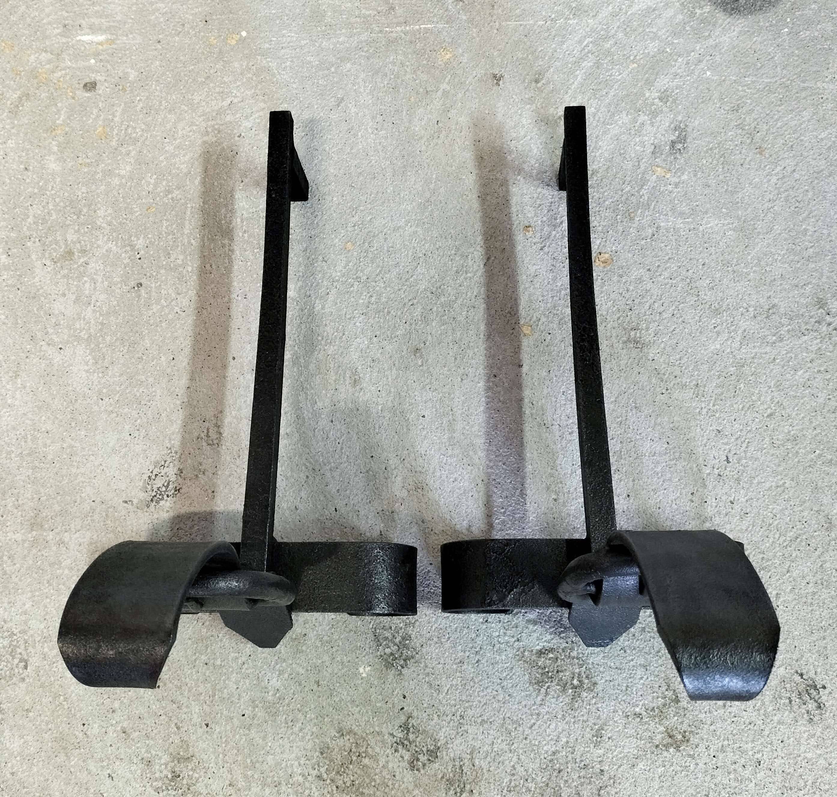 Pair of fire dogs "belt buckle"