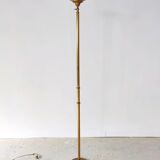 Halogen floor lamp in golden brass