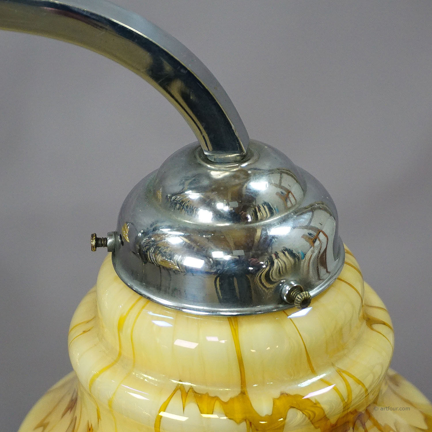 Antique Art Deco chandelier with three glass lampshades.