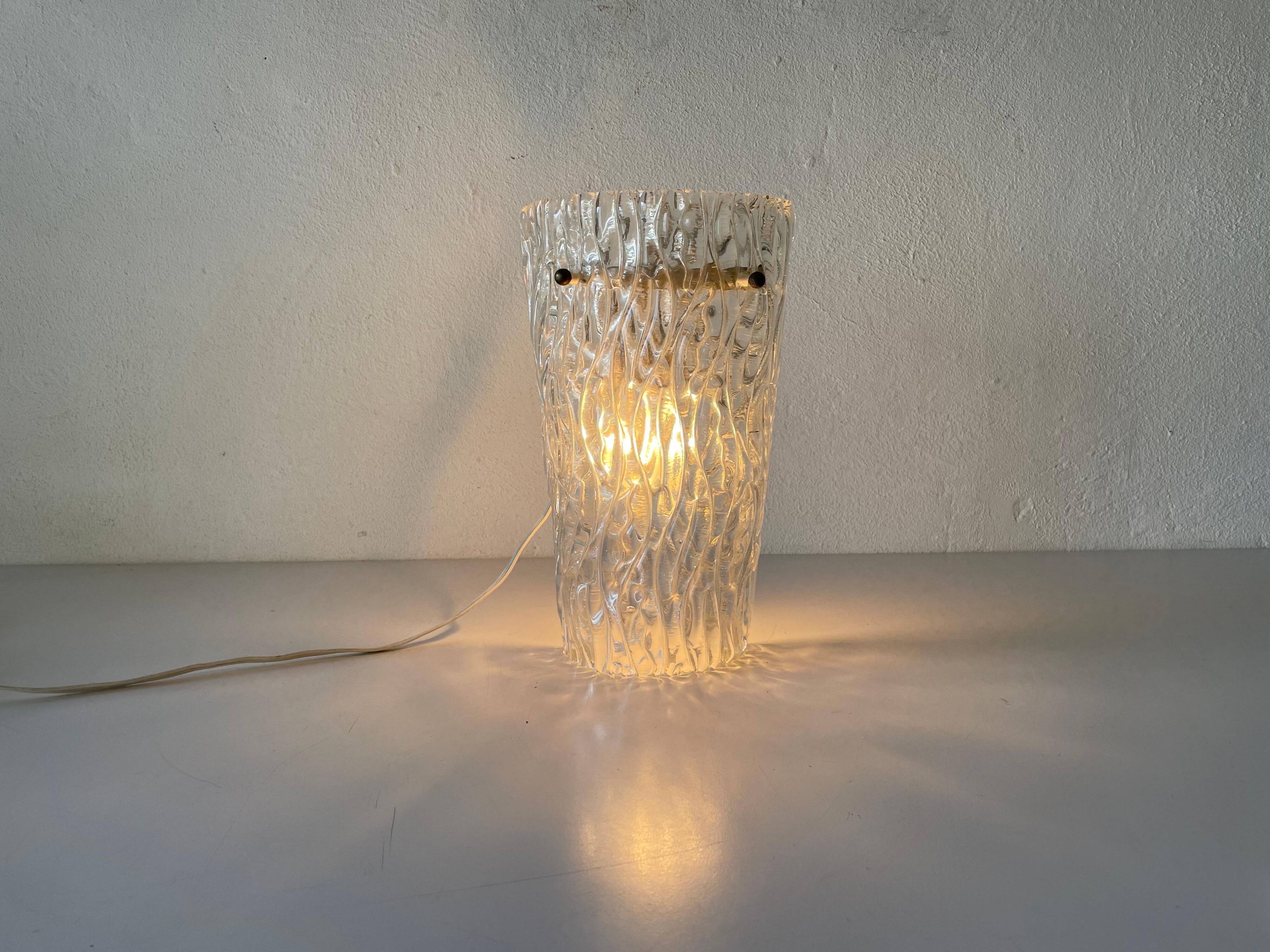 Simple arch-shaped wall light in textured glass, 1950s, Germany.