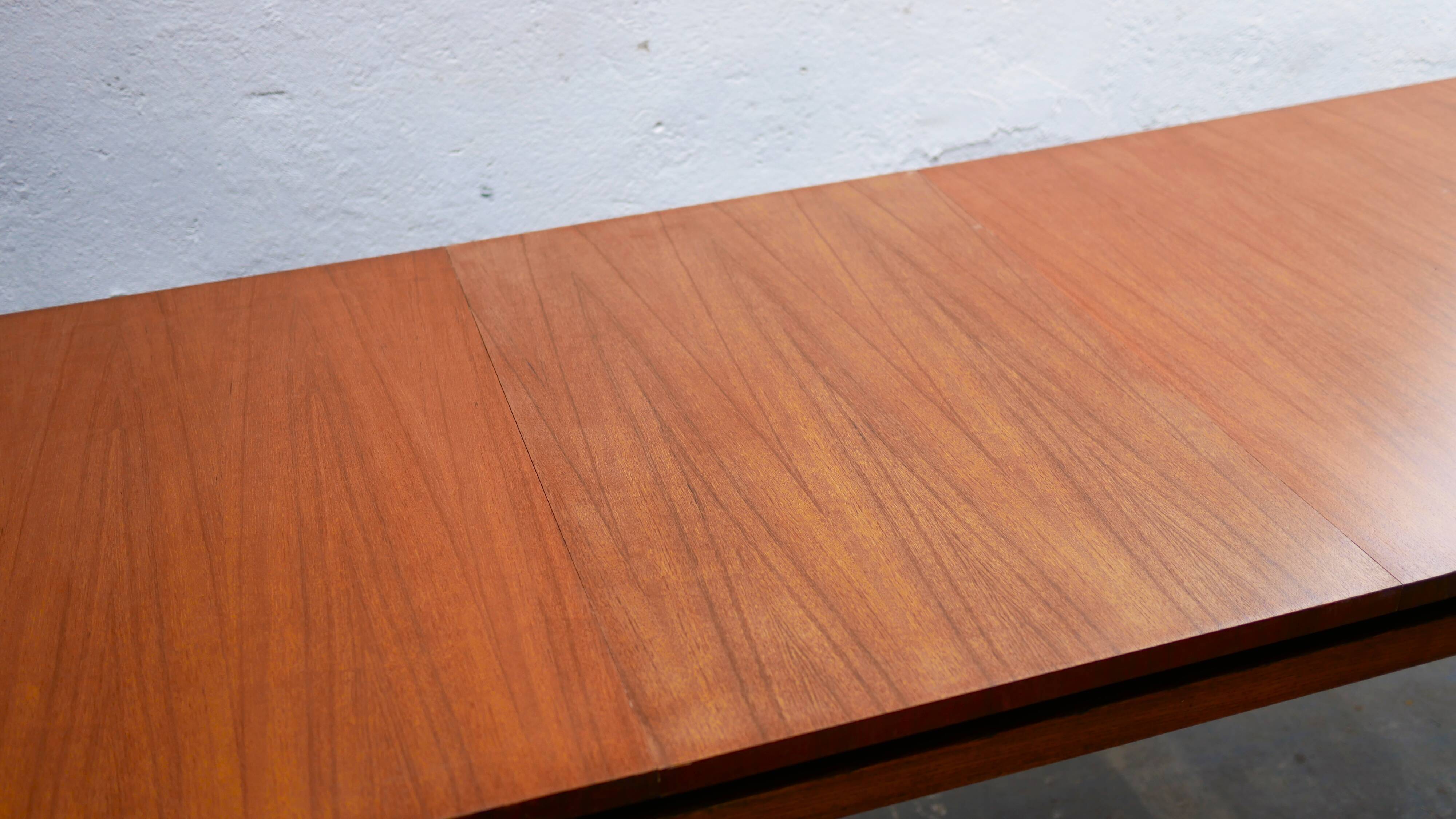 Extendable teak dining table by Gérard Guermonprez for Magnani editions