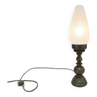 Old bronze or brass table lamp from the early 20th century with opaline white streaked flame glass globe