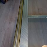 Glass and golden brass coffee table