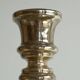 Antique mercury glass candlestick with a patina and silver finish.