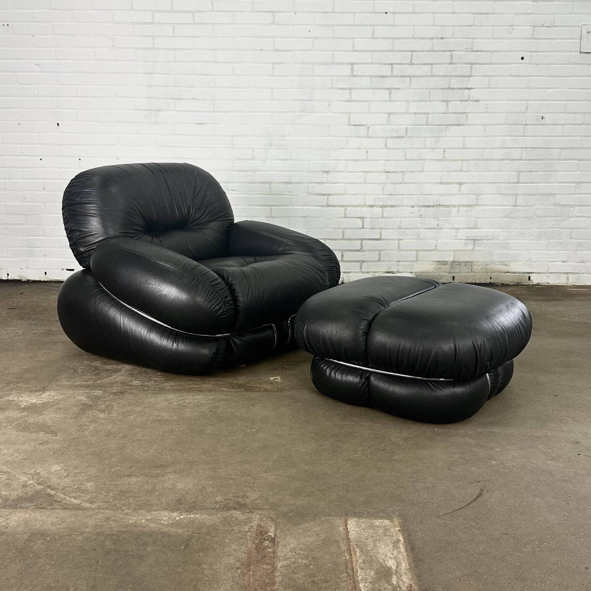 Okay armchair by Adriano Piazzesi in black leather with ottoman