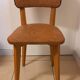 Set of 4 vintage chairs in solid beech and caramel faux leather.