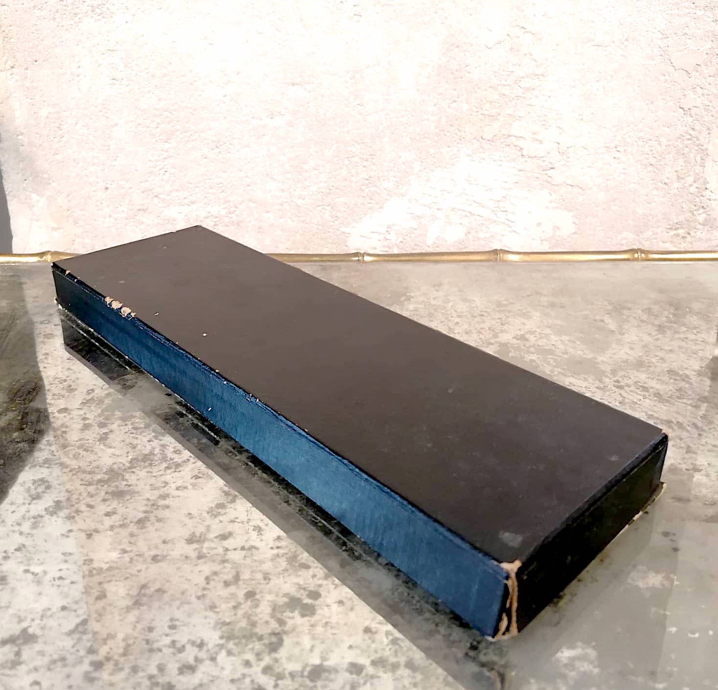 Set of 11 blackened resin knife holders, 1970s