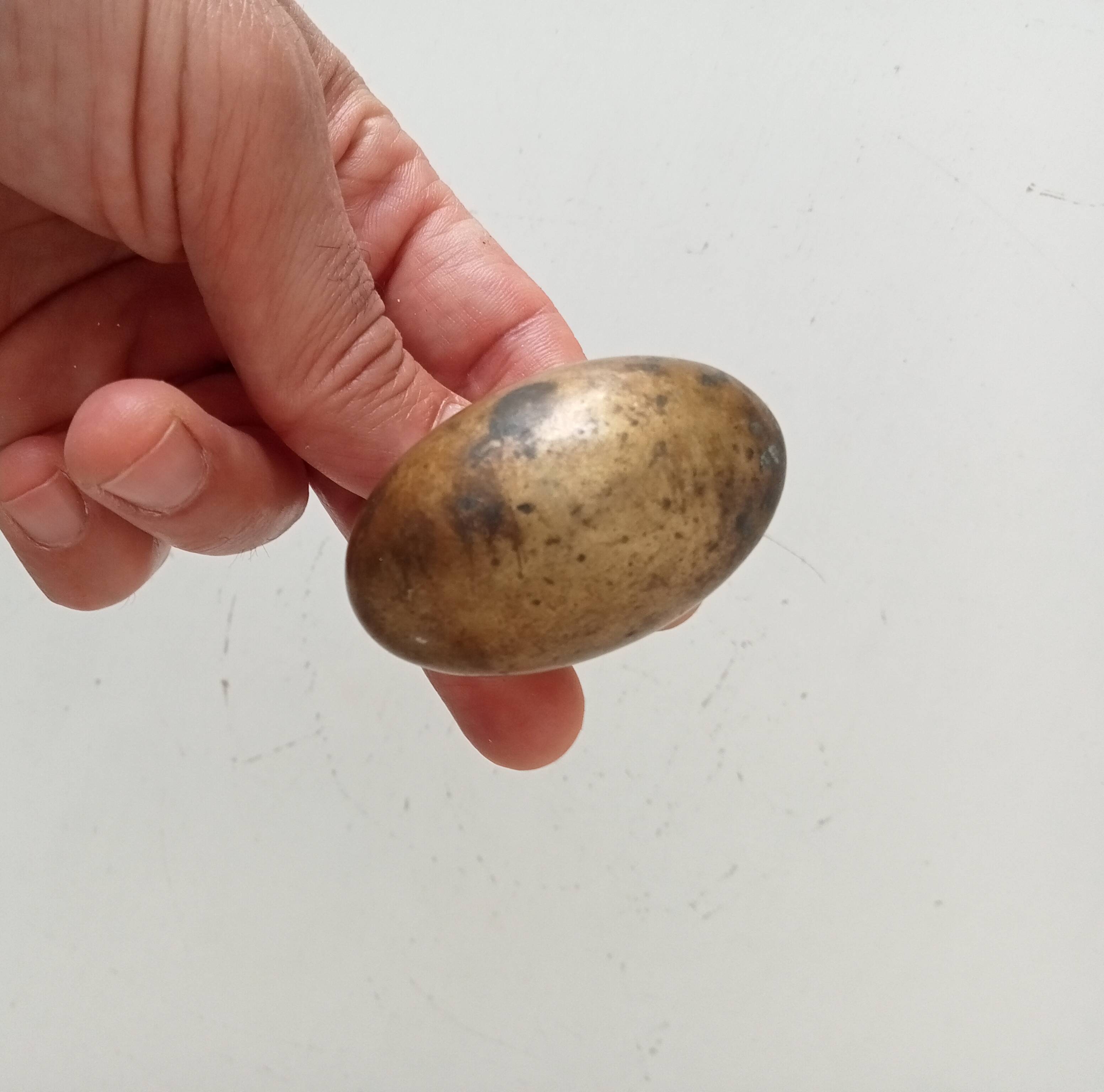 Antique olive door handle from the 19th century.