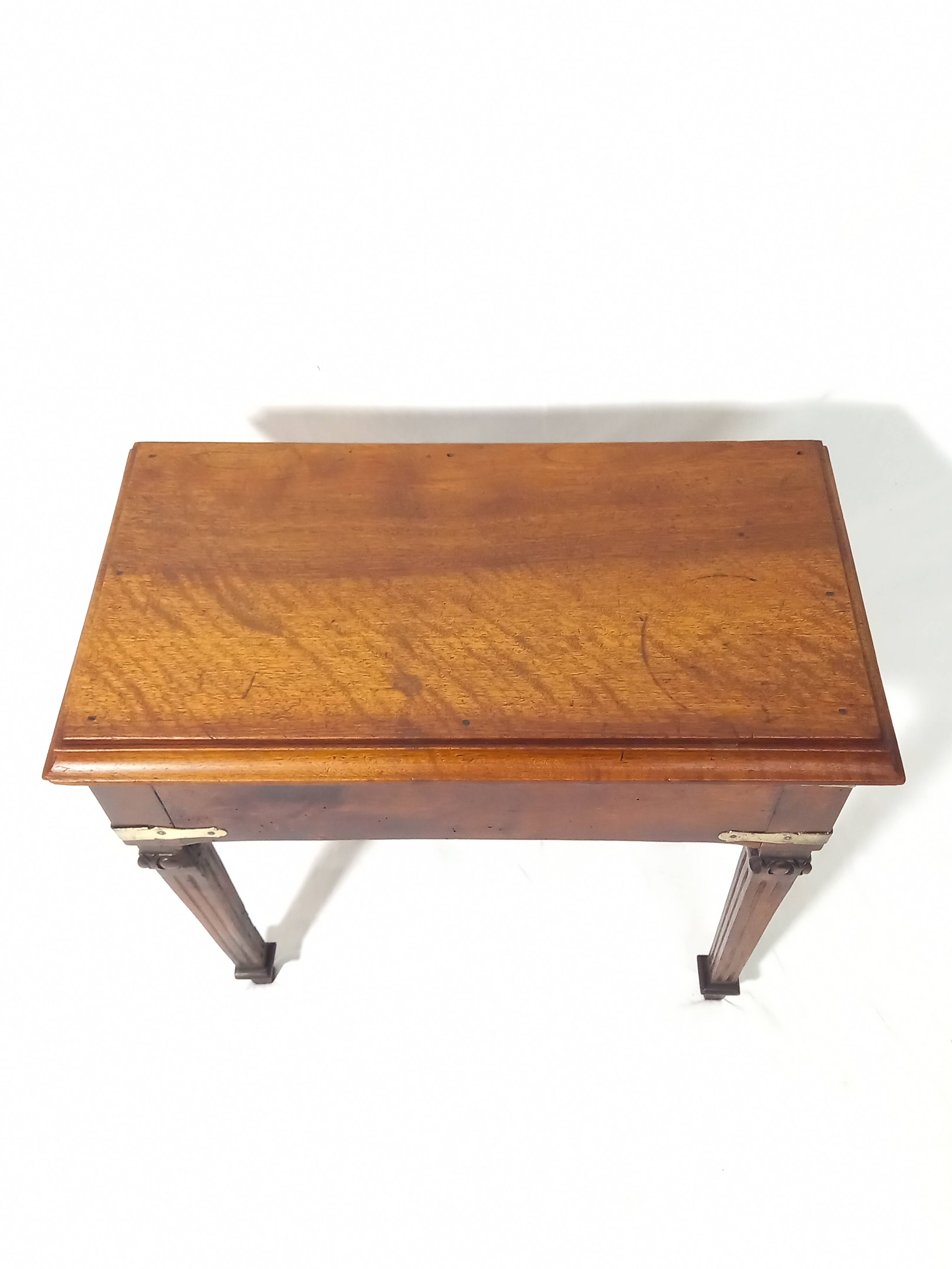 Small old side table with brass finishes