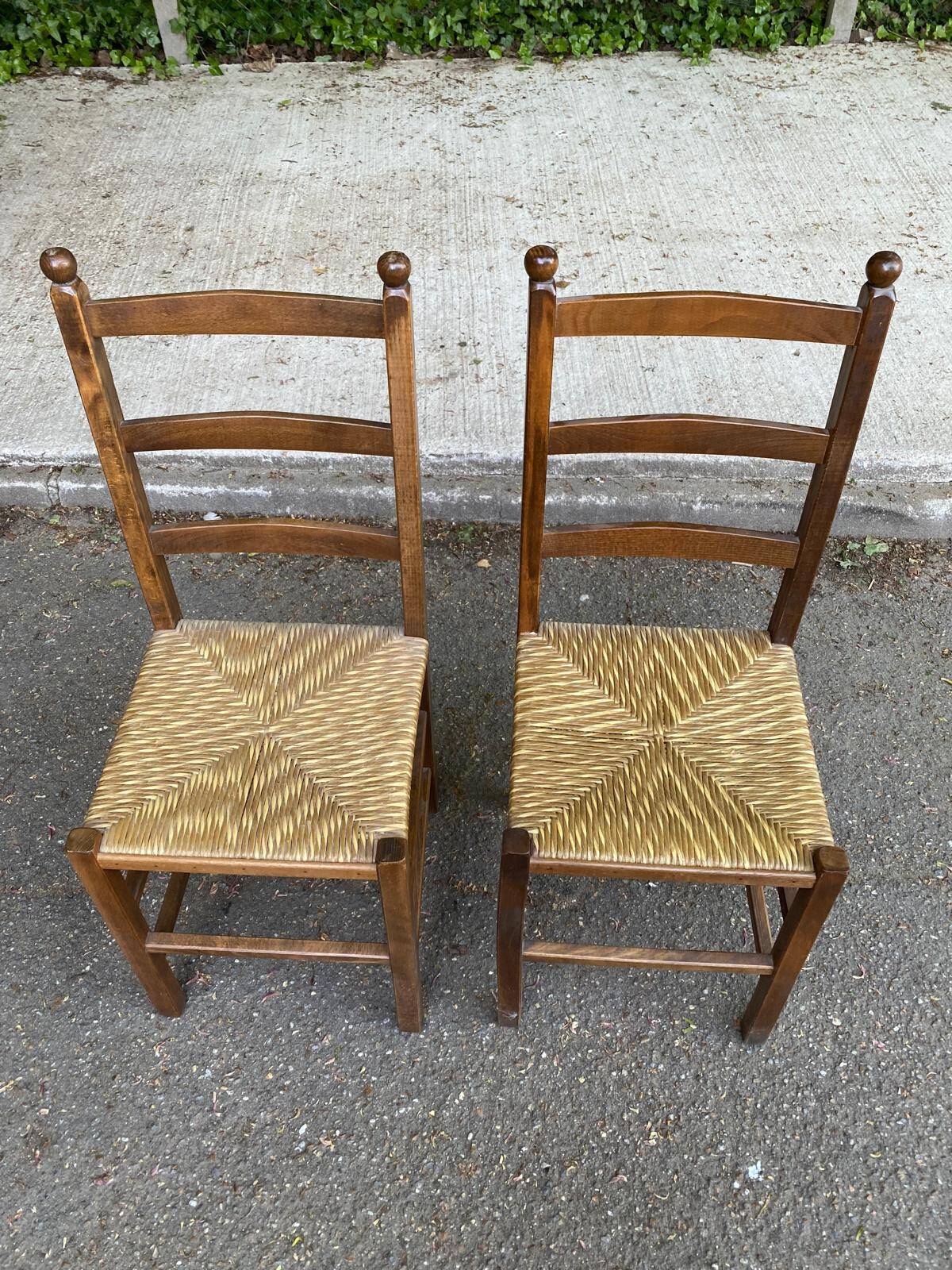 2 solid wood and straw chairs