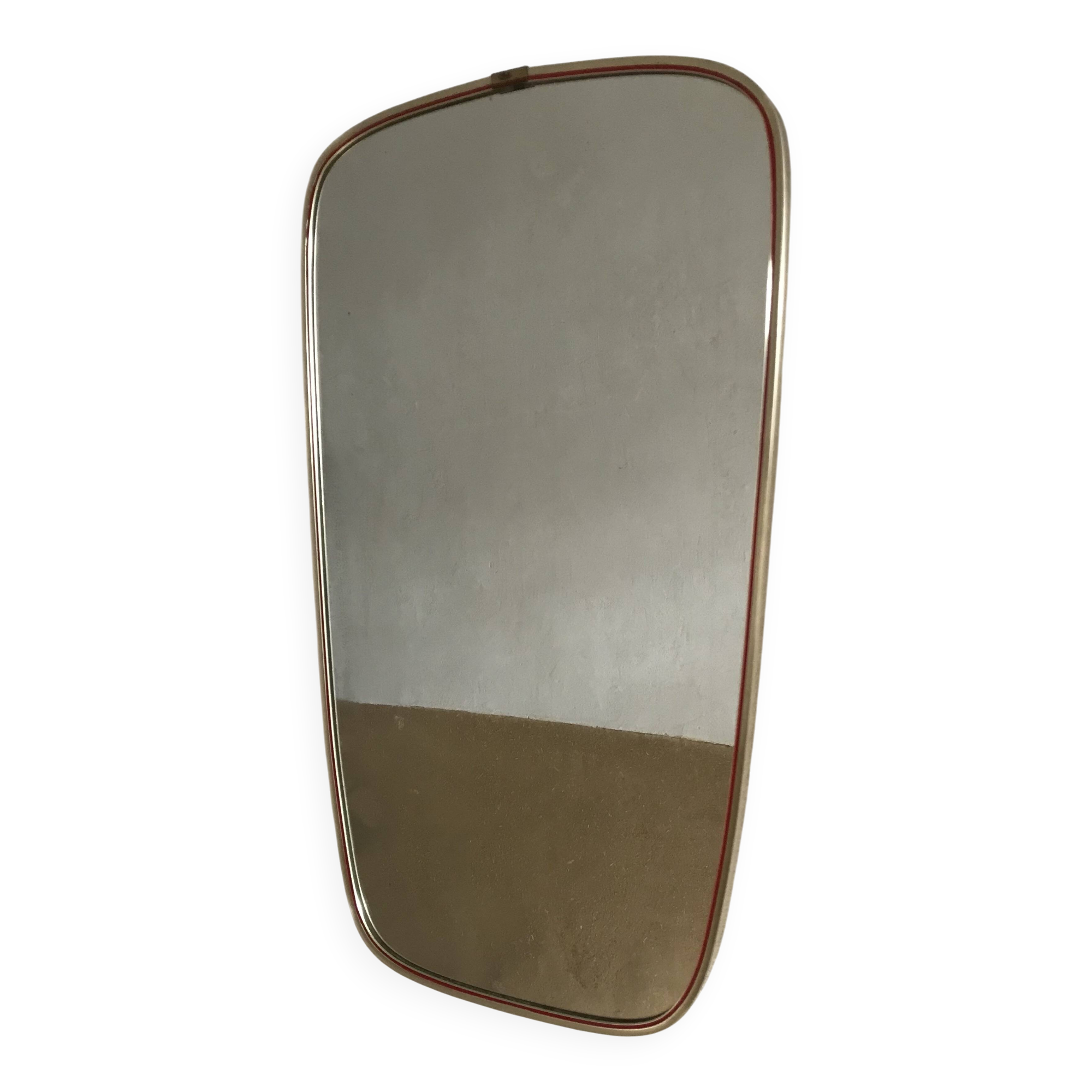Vintage 1960s mirror in a freeform shape with a gold and red trim.