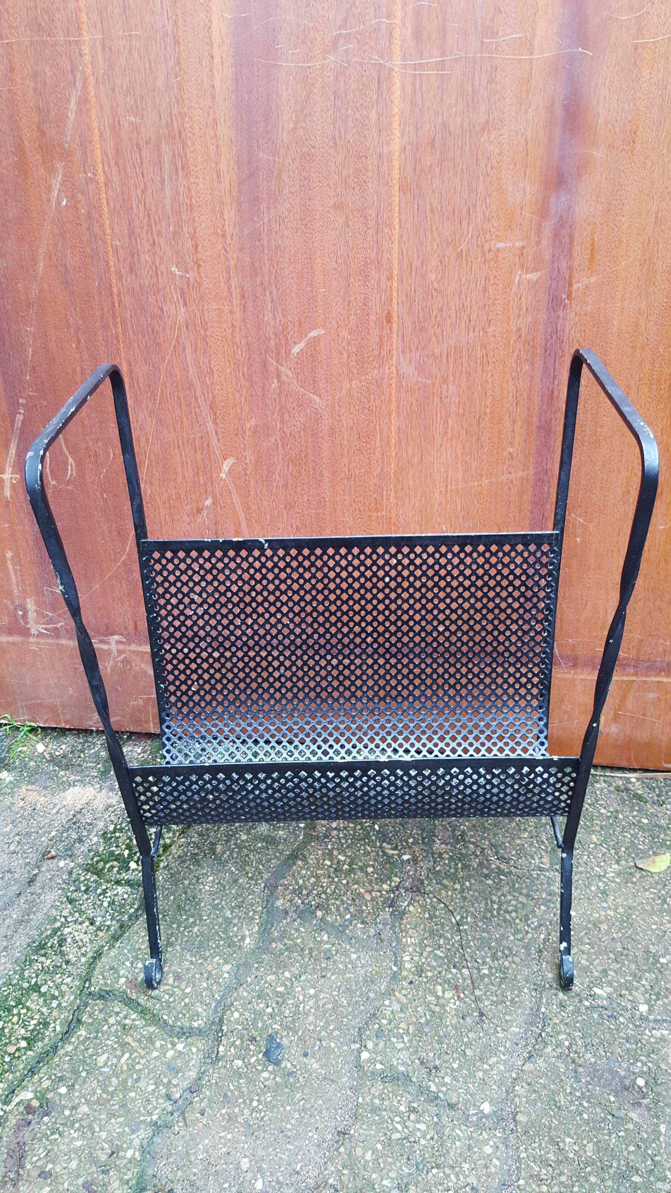 Perforated metal magazine holder design 50