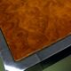 Vintage 1970s coffee table in chrome and burl wood.