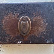 Entrance door in solid oak, cast iron grille, 1930s