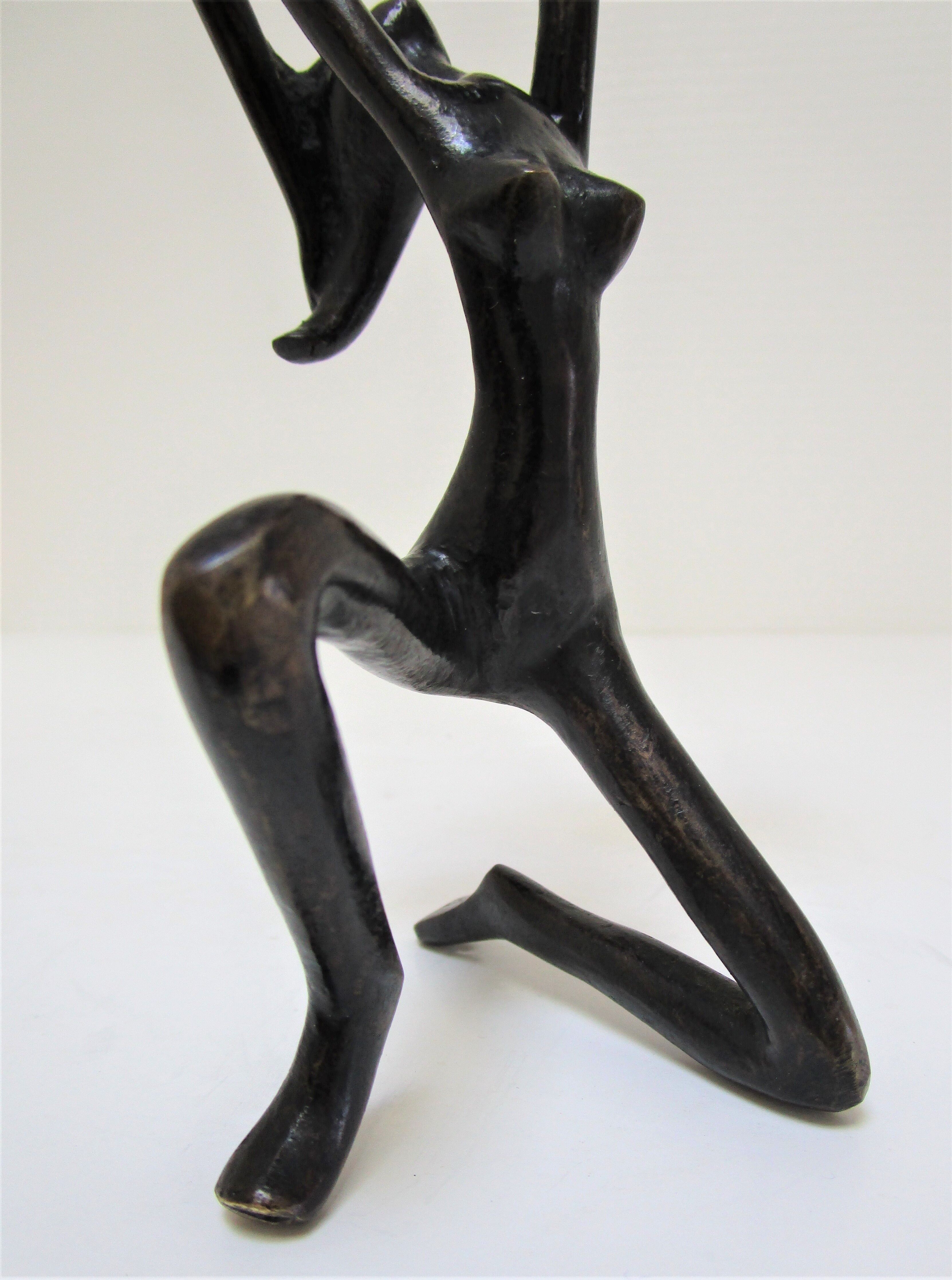 Sculptural candlestick anthropomorphic bronze blackened with woman's figure 70s